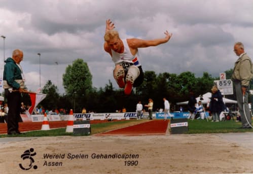 Robert Barrett competing in long jump at the 1990 Para athletics world championships in Assen, Netherlands