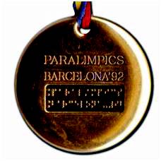 Barcelona 1992 Paralympics back of the gold medal with writing and braille