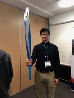 Canadian student holding the London 2012 Paralympic Torch during a visit to NPHT at Stoke Mandeville stadium