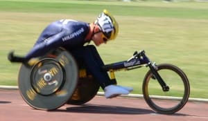 A Bromakin racing wheelchair in action on the track