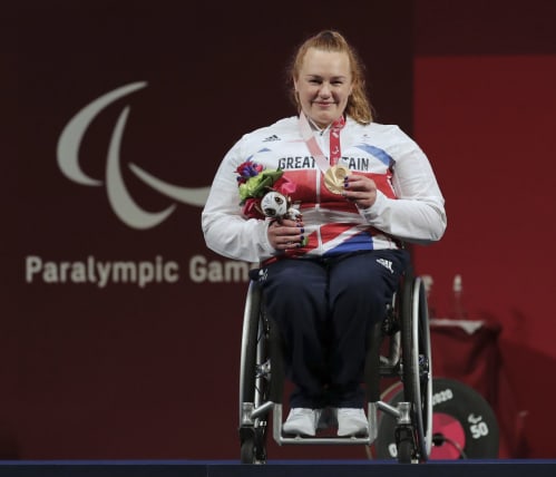 Paralympian Louise Sugden with her bronze medal on the podium at the Tokyo 2020 Paralympic Games.