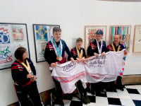 Special Olympians holding a banner at Incredible Me Day at Cartwright Hall Art Gallery
