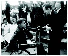 Dick Thompson handed the scroll to Richard Thompson at the 1958 Stoke Mandeville Games