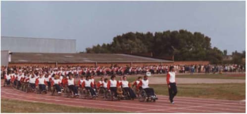 Tony Sainsbury, Team Manager, leading the British team at the opening ceremony of the 1984 Stoke Mandeville Games