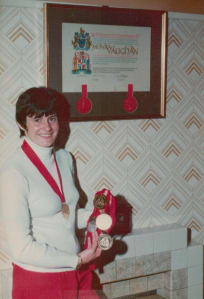 Monica with her Paralympic medals and scroll from City of Portsmouth after competing at the Toronto 1976 Paralympics