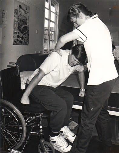 A wheelchair patient having physiotherapy