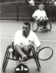 Peter Norfolk at the Japanese Open using an early three-wheel chair for wheelchair tennis in 1998
